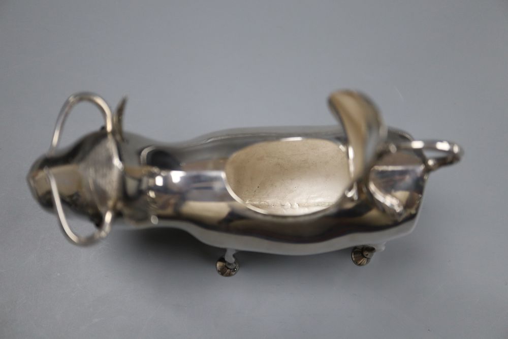 A mid 20th century Dutch white metal cow creamer, length 14cm, gross 145 grams.